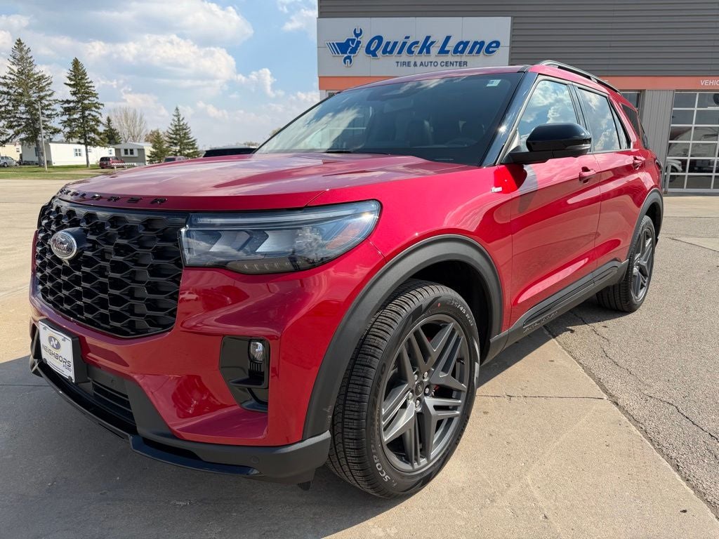 2026 Ford Explorer ST-Line in Rapid Red Metallic Tinted Clearcoat — front three-quarter view